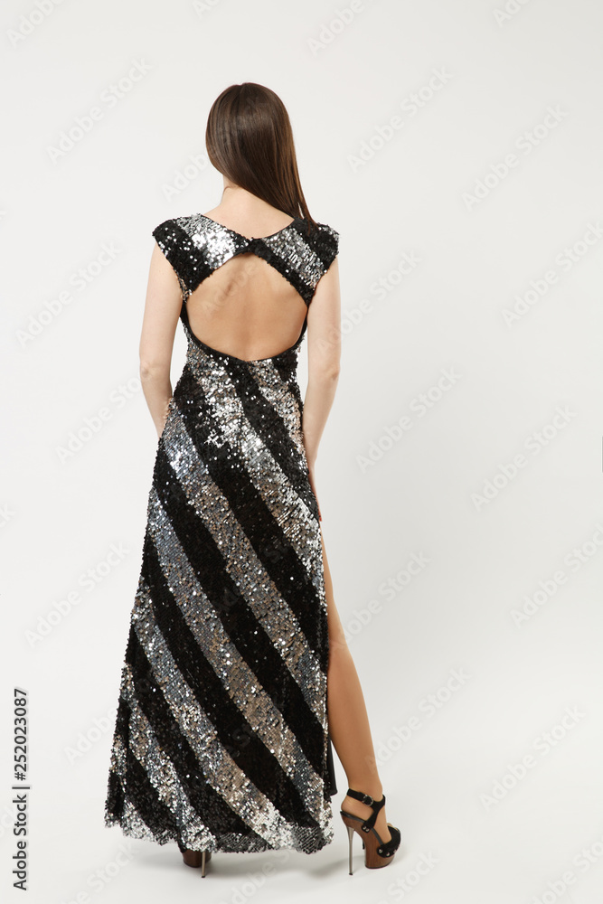 Φωτογραφία Full length photo of fashion model woman wearing elegant evening dress black gown posing isolated on white wall background studio portrait