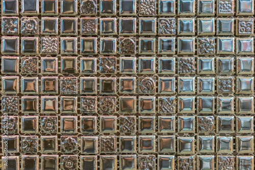 abstract square pixel mosaic wall background and texture. brown glass mosaic tile background pattern © jollier_