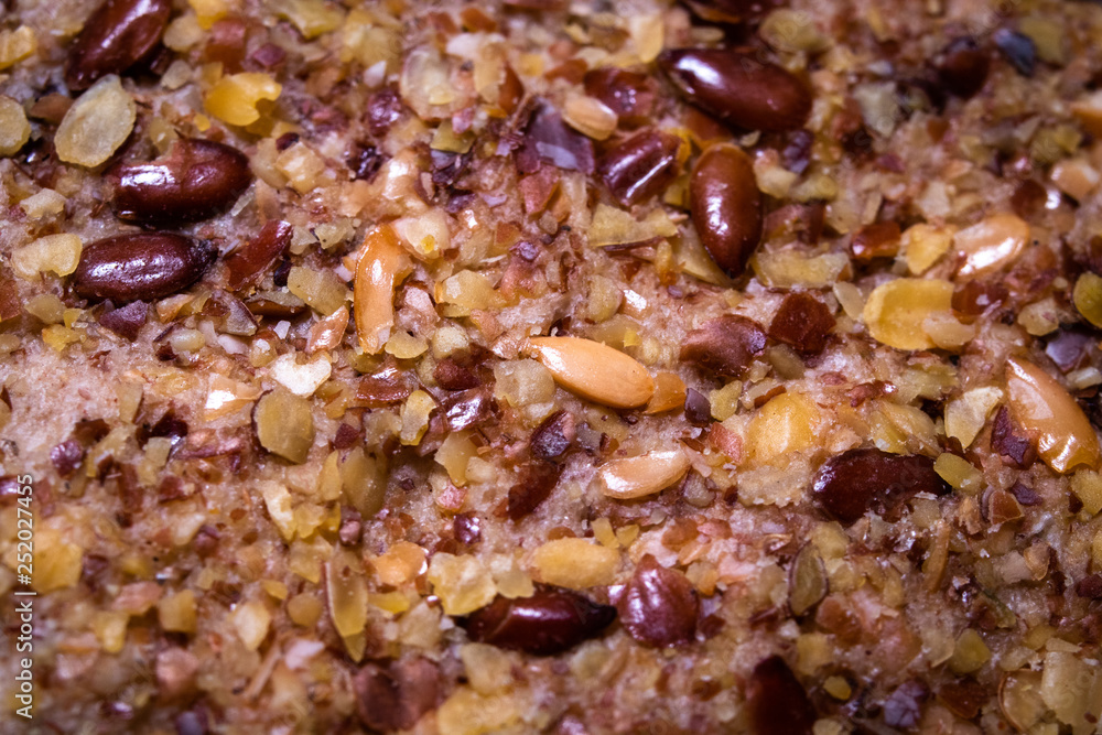 Integral crackers with healthy seeds: linseeds, chia, cracked pumpkin seeds, sunflower, sesame and spices with whole wheat flour. Macro photography Integral crackers with healthy seeds: linseeds, chia, cracked pumpkin seeds, sunflower, sesame and spices with whole wheat flour. Macro photography