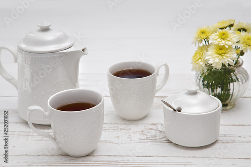 teatime cups of tea on wooden white table