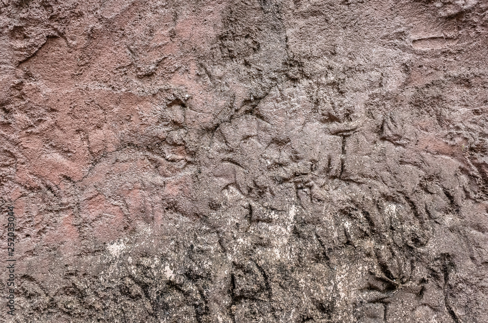 Fototapeta premium rough stone wall in brown color