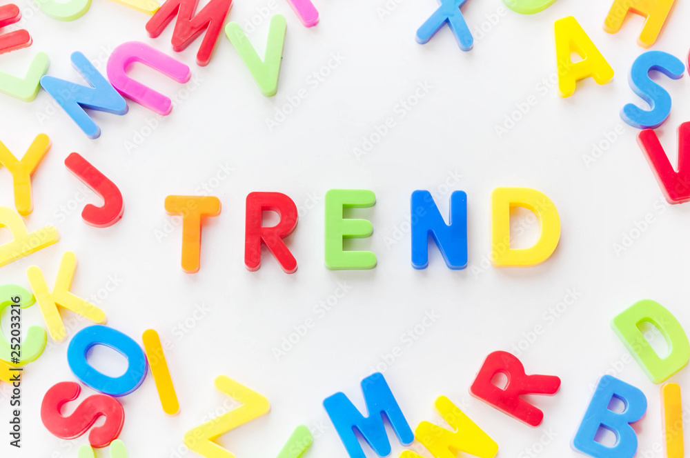 Fototapeta premium Trends concept. Coloured letters on white background. Be in trend