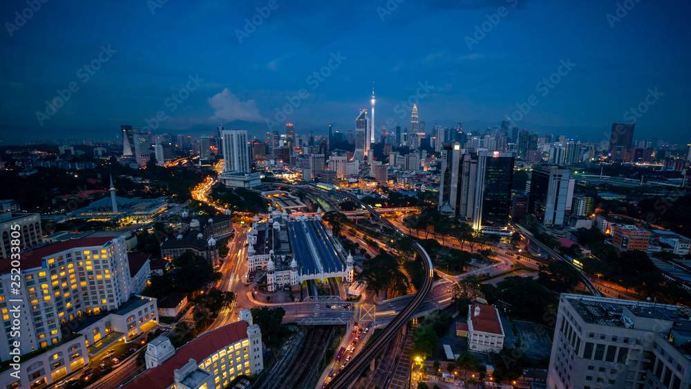 Cloudy sunset over Kuala Lumpur City Skyline showing the transportation arteries withing the heart of the city's transportation hub.