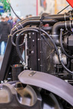 Modern new agricultural diesel tractor engine. Modern new hi-tech engine of loader or small tractor. Top view. The big new engine on a show window. vertical photo