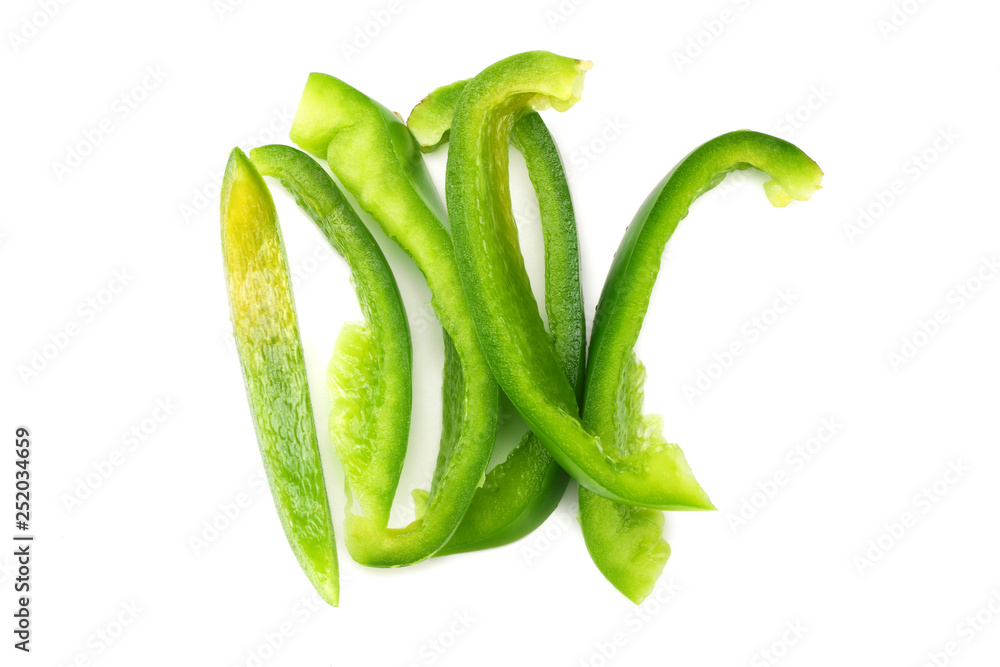 cut slices of green sweet bell pepper isolated on white background top view