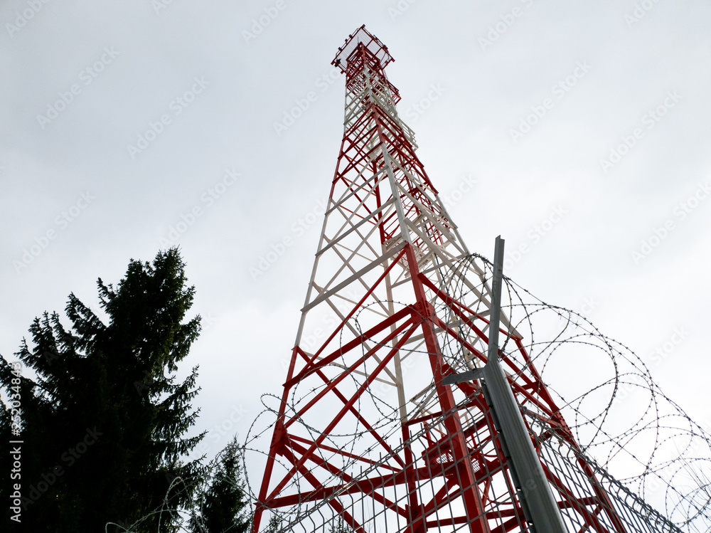 Radio tv radio communication. Communication tower in the forest close up. Radio tv radio communication. Communication tower in the forest close up.