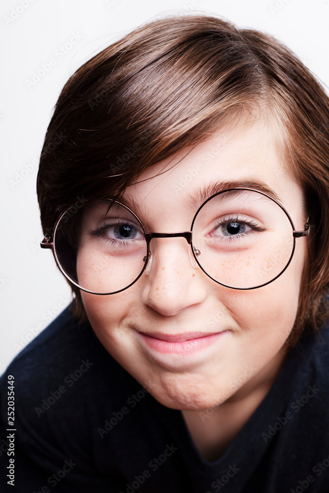 Handsome boy is wearing eyeglasses. Isolated on white background Handsome boy is wearing eyeglasses. Isolated on white background