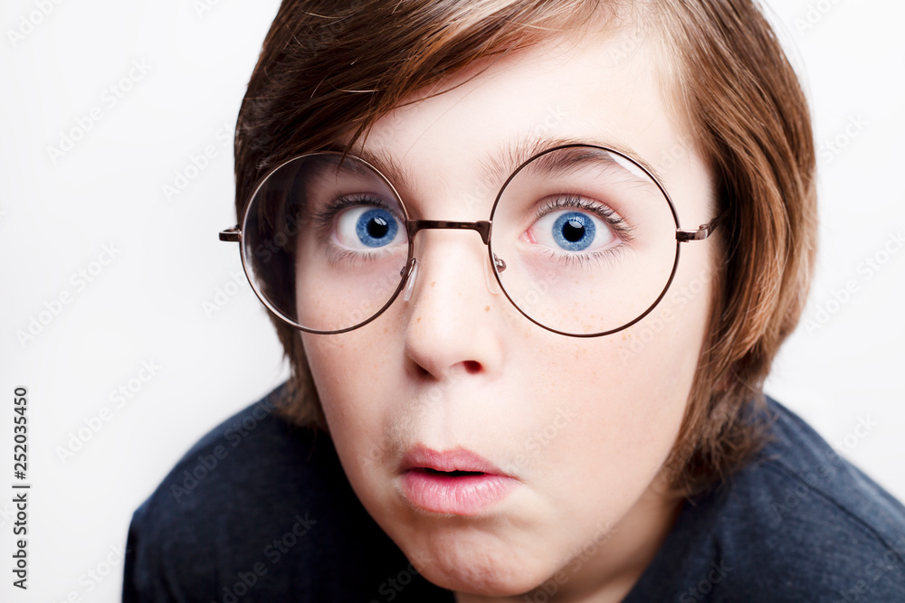 Handsome boy is wearing eyeglasses. Isolated on white background