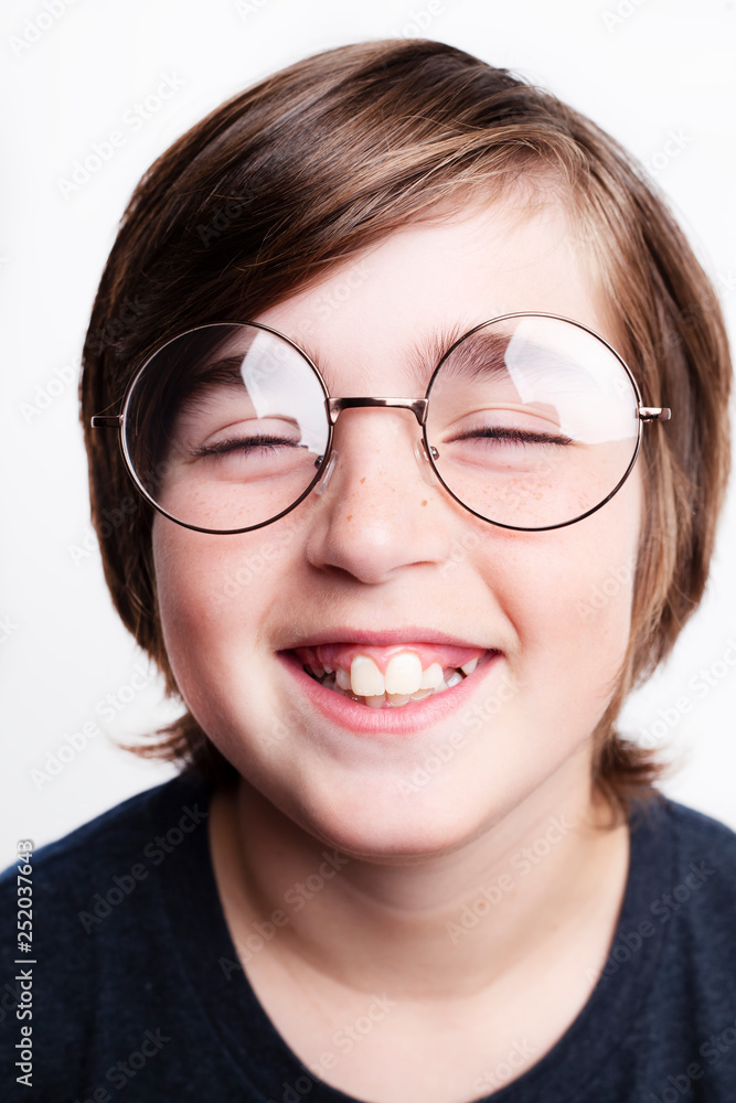 Handsome boy is wearing eyeglasses. Isolated on white background Handsome boy is wearing eyeglasses. Isolated on white background