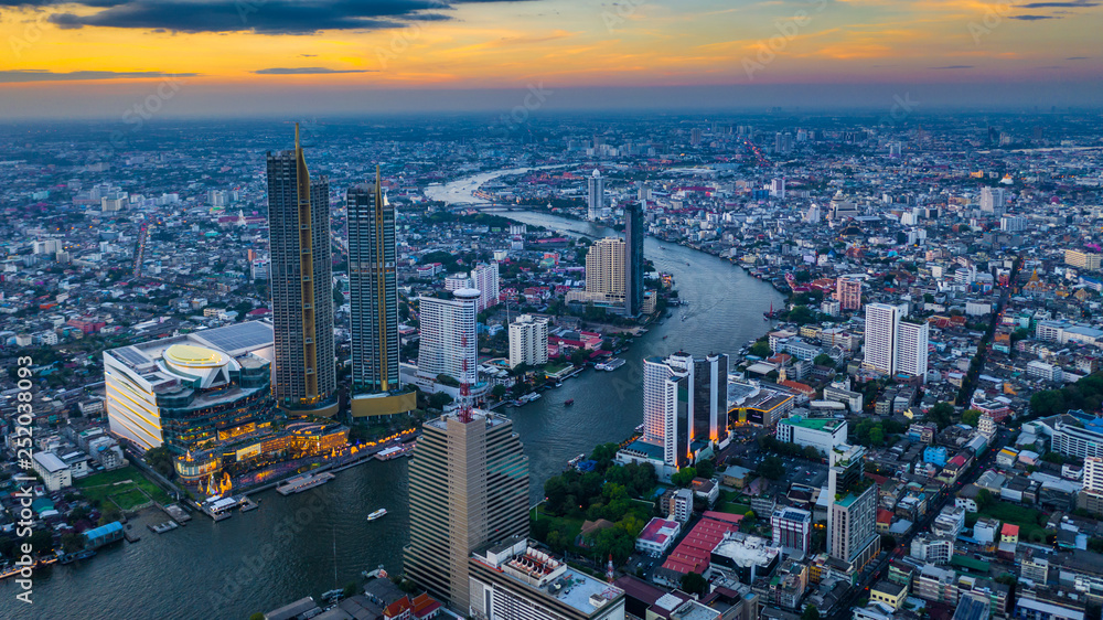 Fototapeta premium Bangkok City aerial view, Aerial view from above of skyscraper and chao phaya river in Bangkok, Thailand.