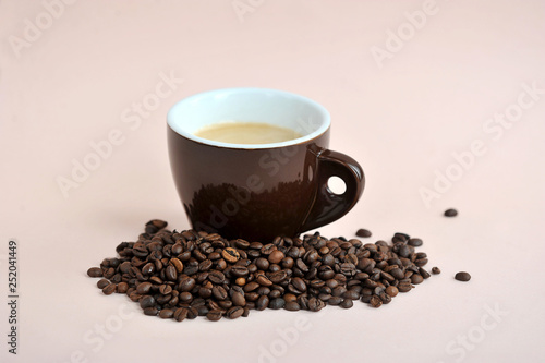 brown coffee Cup and coffee beans