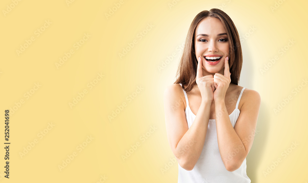 young woman showing smile, on pink young woman showing smile, on pink