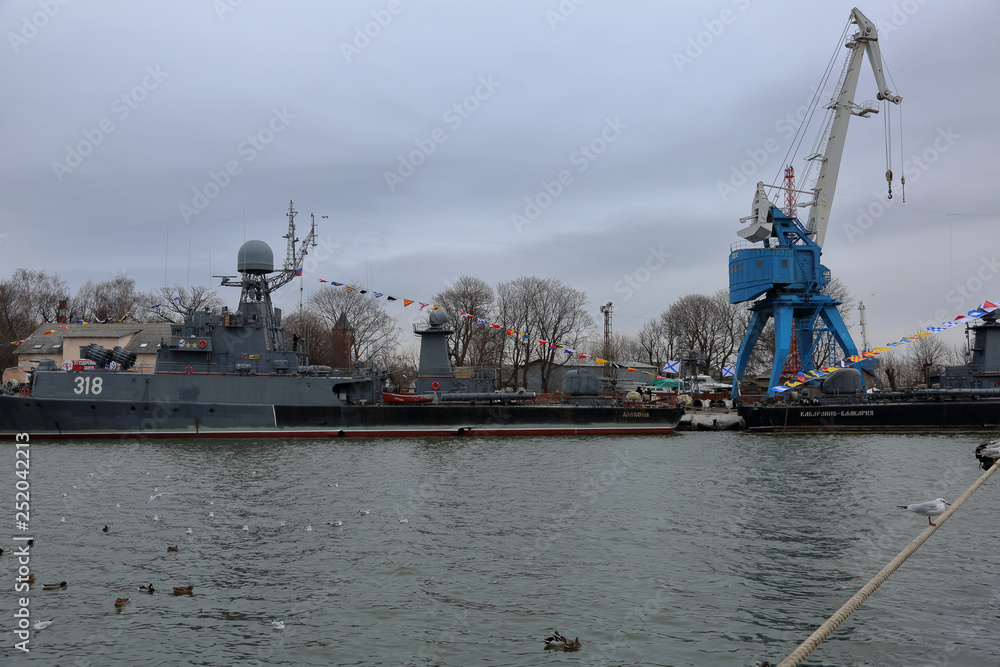 Ship in the Baltic Sea bay at the Baltiysk city embankment, Russia