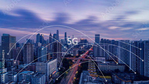 5G network wireless systems and internet of things with modern city skyline
