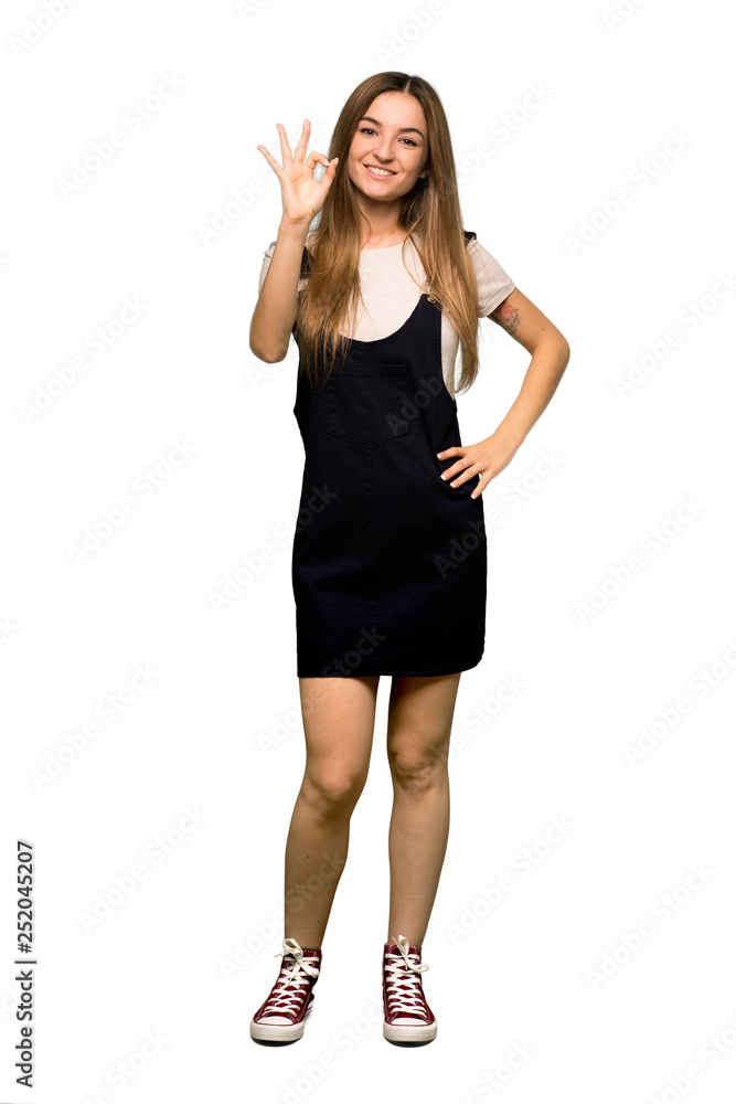 Full body Young pretty woman showing an ok sign with fingers on isolated background Full body Young pretty woman showing an ok sign with fingers on isolated background