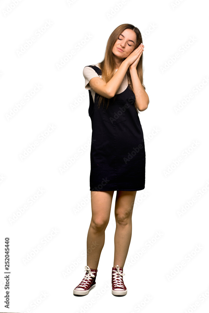 Full body Young pretty woman making sleep gesture in dorable expression on isolated background Full body Young pretty woman making sleep gesture in dorable expression on isolated background