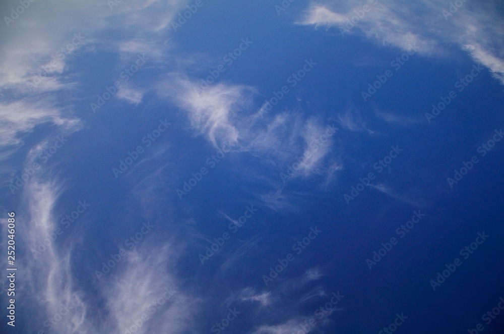 Beautiful natural pattern of white clouds and blue sky. Waving white clouds and consecutive blue color from bright to dark with freedom. Beautiful natural pattern of white clouds and blue sky. Waving white clouds and consecutive blue color from bright to dark with freedom.