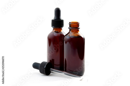 фотографія Homeopathic remedy and liquid tincture medicines concept with close up on two br