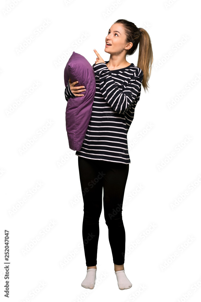 Full body Pretty woman in pajamas pointing with the index finger and looking up on isolated background Full body Pretty woman in pajamas pointing with the index finger and looking up on isolated background