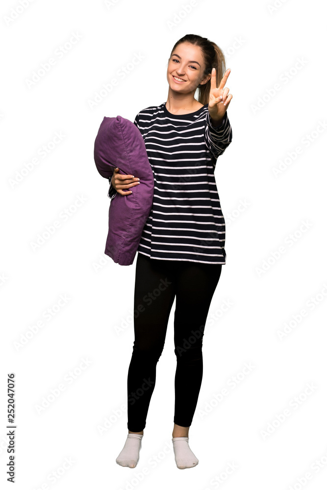 Full body Pretty woman in pajamas smiling and showing victory sign on isolated background Full body Pretty woman in pajamas smiling and showing victory sign on isolated background