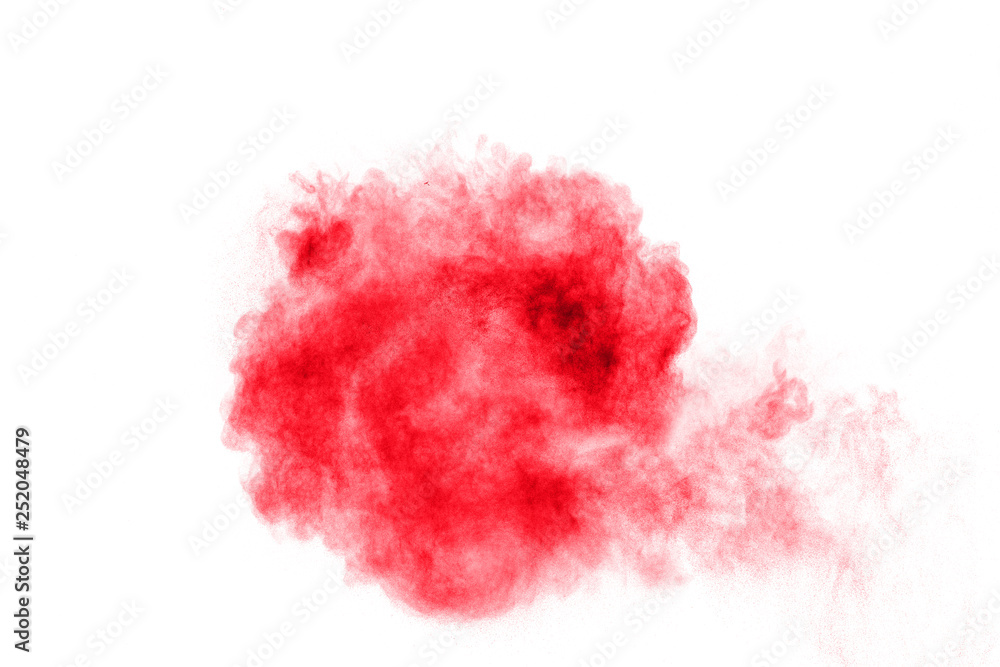 abstract red dust explosion on white background. Abstract red powder splattered on white  background. Freeze motion of red powder splash.