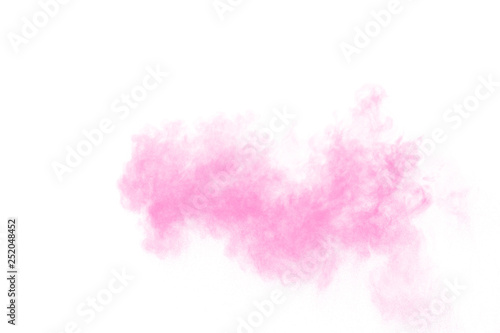 Pink powder explosion on white background.Pink dust splashing. Launched colorful particles on background.