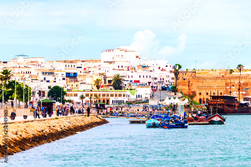 Fishing boats in Rabat, Morocco with old building at the background