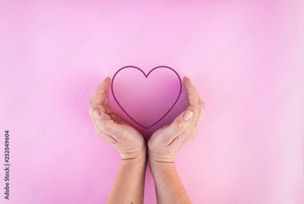 womans hands around heart on isolated background womans hands around heart on isolated background