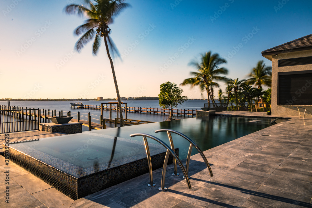 Beautiful Waterfront Pool At Sunset