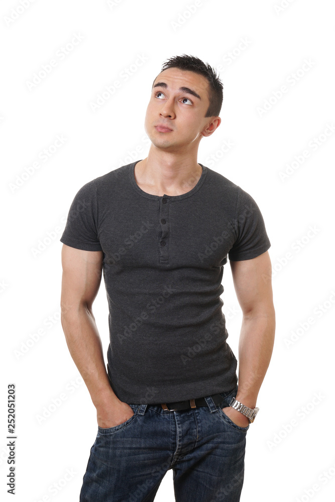 casual young man looking up towards copy space casual young man looking up towards copy space