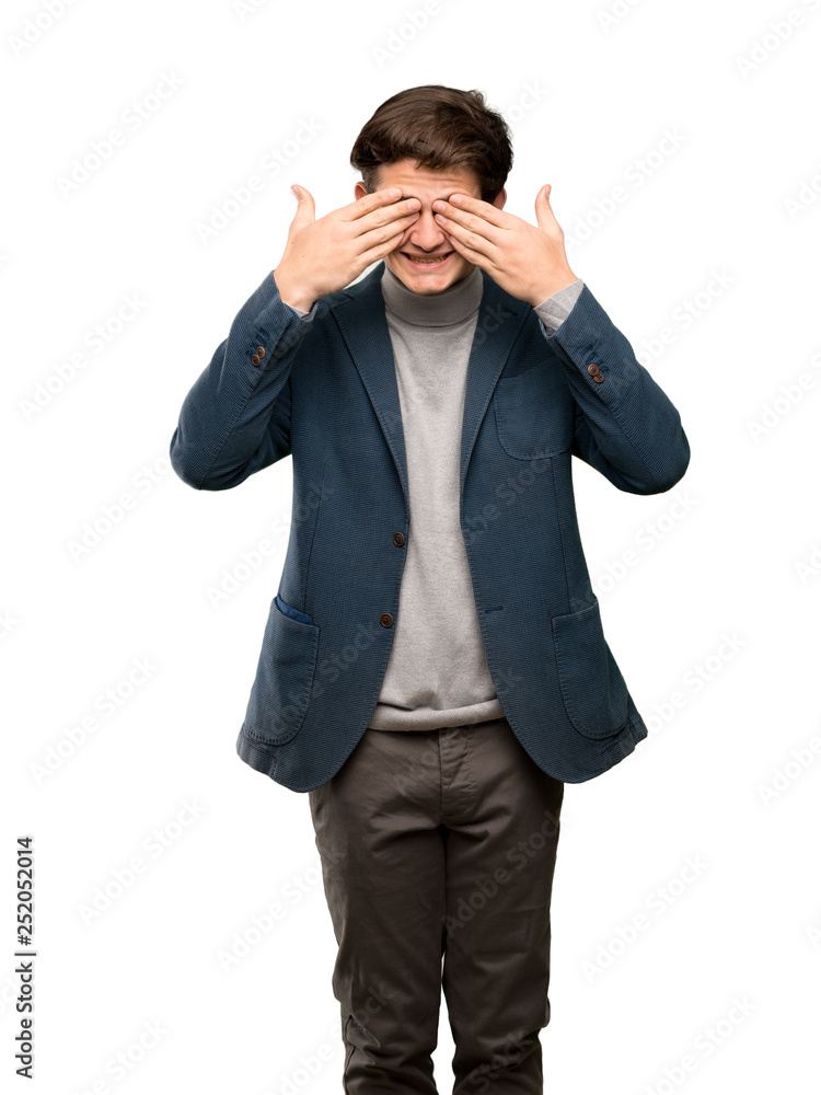 Teenager man with turtleneck covering eyes by hands. Surprised to see what is ahead over isolated white background Teenager man with turtleneck covering eyes by hands. Surprised to see what is ahead over isolated white background