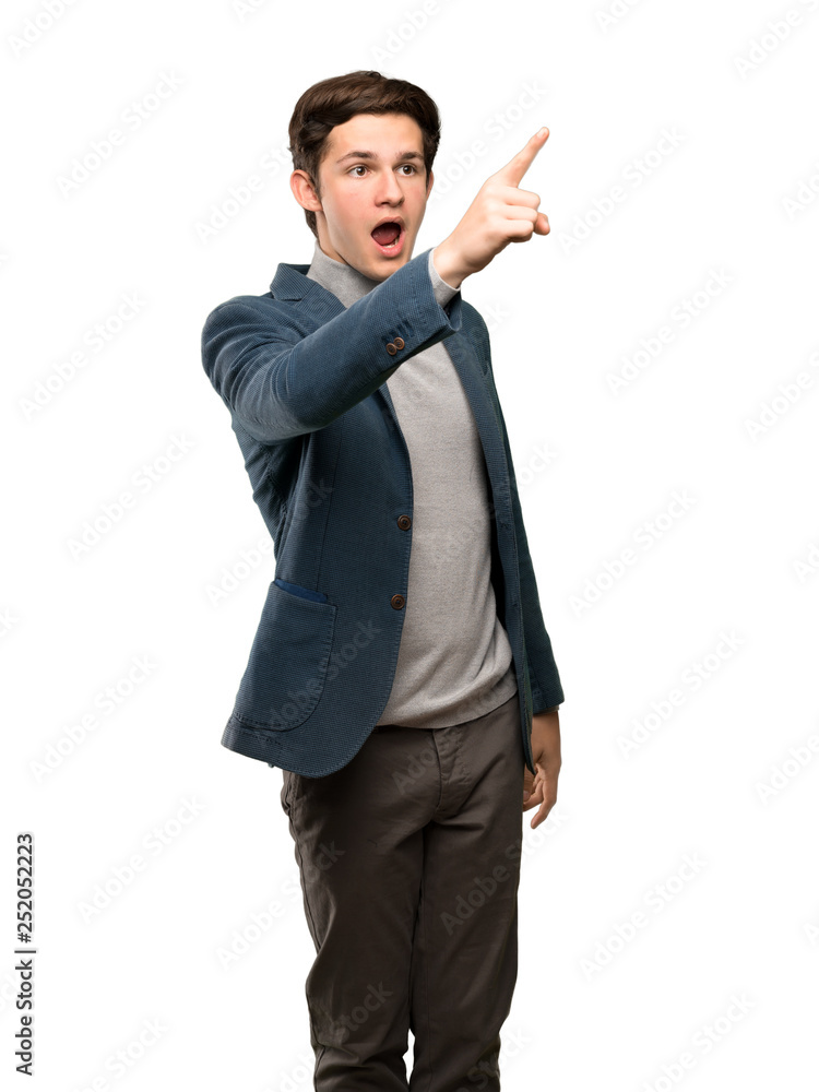Teenager man with turtleneck pointing away over isolated white background Teenager man with turtleneck pointing away over isolated white background