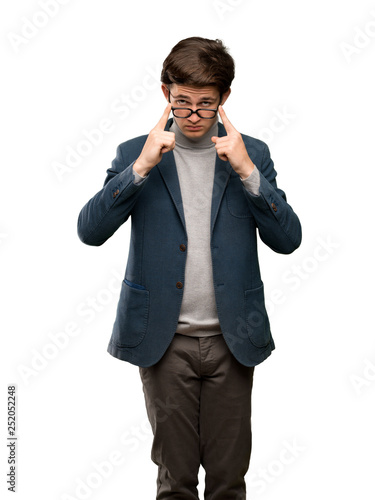 Teenager man with turtleneck with glasses and surprised over isolated white background