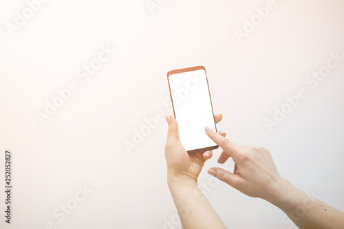 Close-up hand use phone.