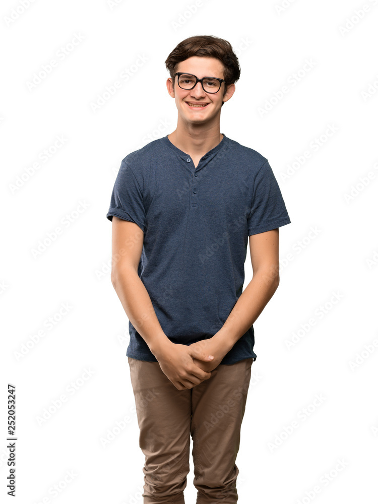 Fototapeta premium Teenager man with glasses and happy over isolated white background