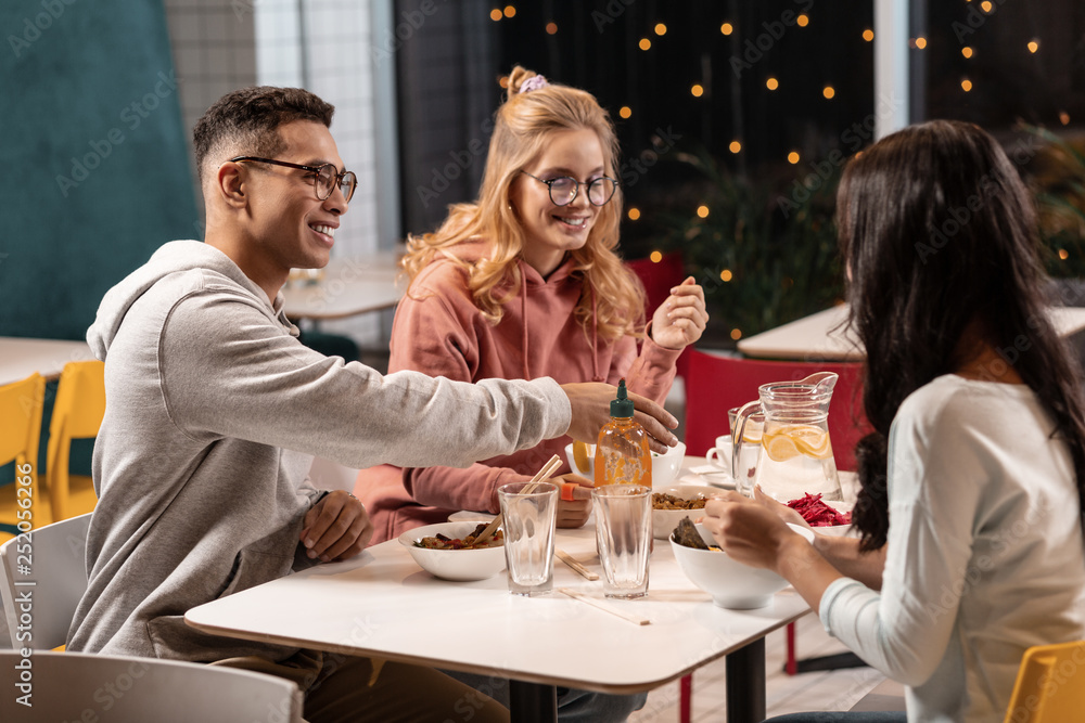 Company of friends having dinner together in cafe. Company of friends having dinner together in cafe.