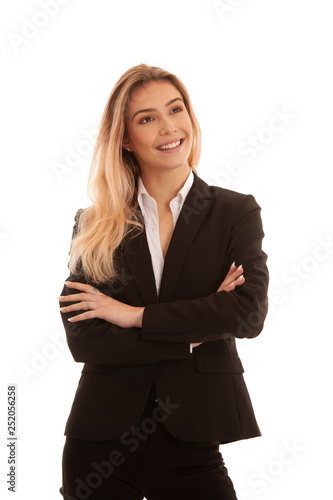 Beautiful blond young business woman in black suit isolated over white
