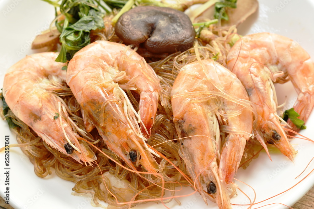 shrimp steamed with glass noodle and ginger on white plate