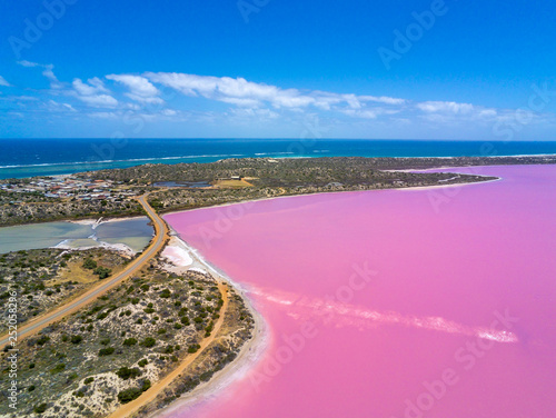 Aerial image of the Pink Lake and Gregory in Western Australia with Indian Ocean in background