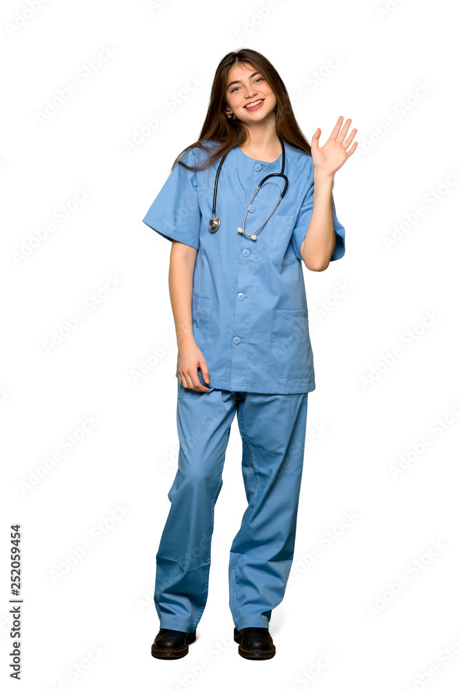Full-length shot of Young nurse saluting with hand with happy expression on isolated white background Full-length shot of Young nurse saluting with hand with happy expression on isolated white background