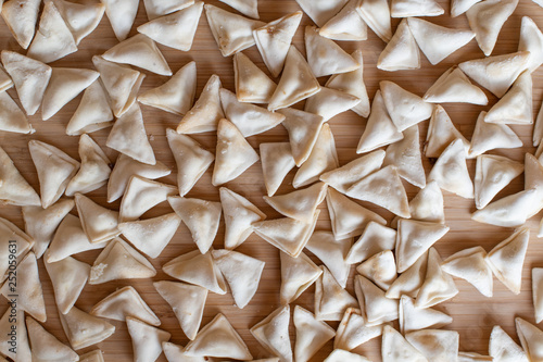 raw, uncooked triangle shaped manti. traditional turkish food. turkish ravioli