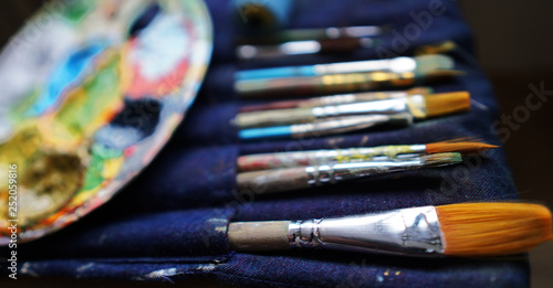 artist's brushes and paint