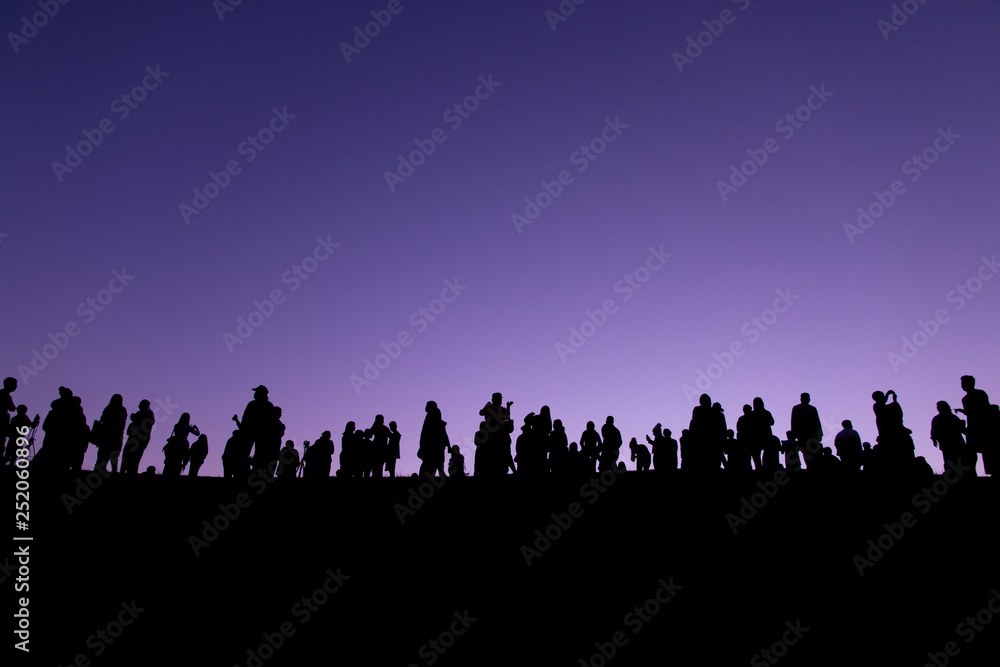 Silhouette of tourists looking at view with sunrise in the morning. Silhouette of tourists looking at view with sunrise in the morning.
