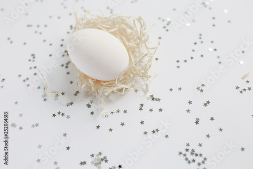 Easter. White Easter Egg. Silver. Bokeh.