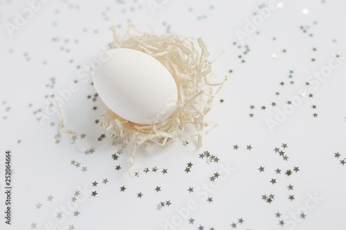Easter. White Easter Egg. Silver. Bokeh.