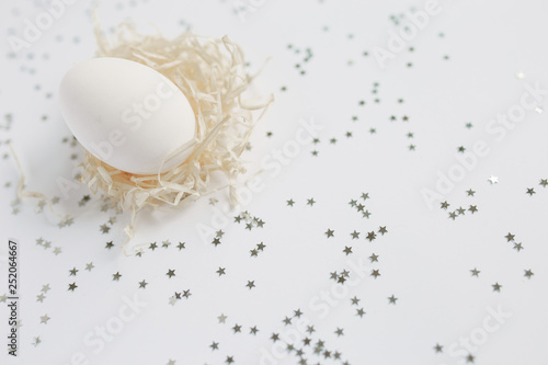 Easter. White Easter Egg. Silver. Bokeh.