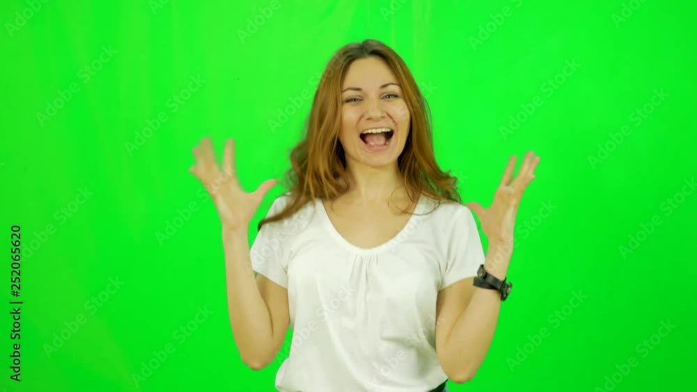 Happy smiling woman wins at bitcoin exchange close-up green-screen shot Happy smiling woman wins at bitcoin exchange close-up green-screen shot