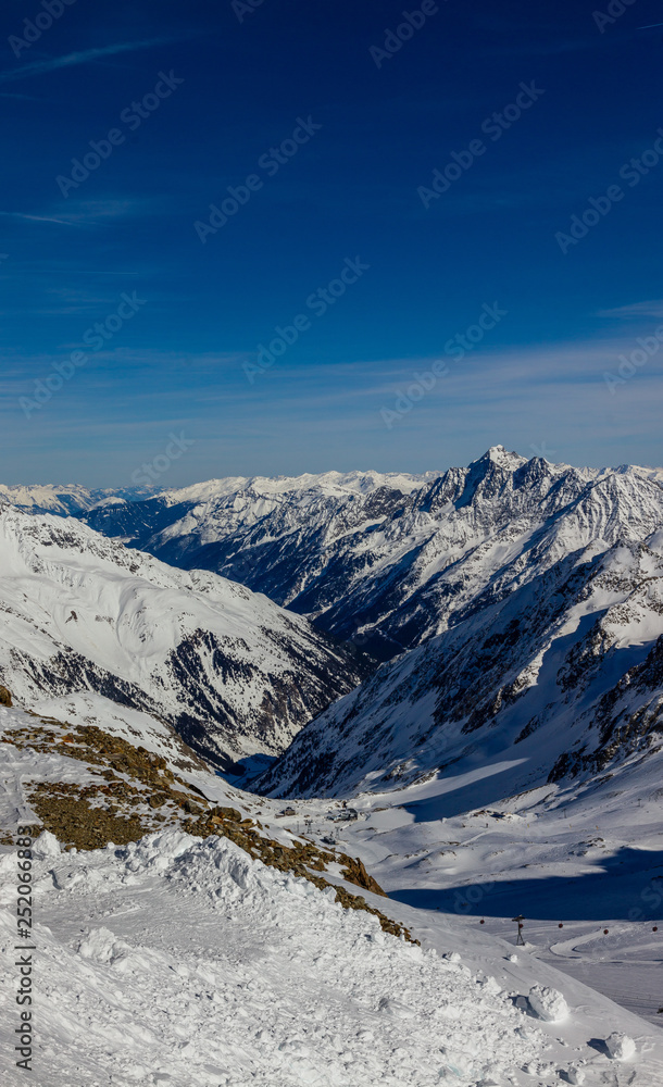 view from the highest accessible point to the slopes and ravine in the Kingdom of snow Stubaier Gletscher ski resort in the Stubai valley, Tirol, Austria