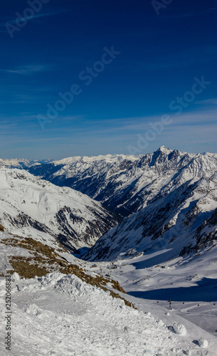 view from the highest accessible point to the slopes and ravine in the Kingdom of snow Stubaier Gletscher ski resort in the Stubai valley, Tirol, Austria © Кирилл Пименов