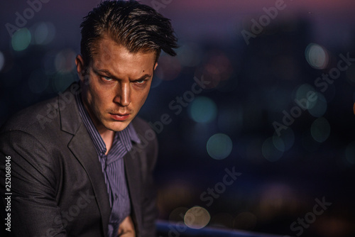 Caucasian male in suit at the rooftop portait